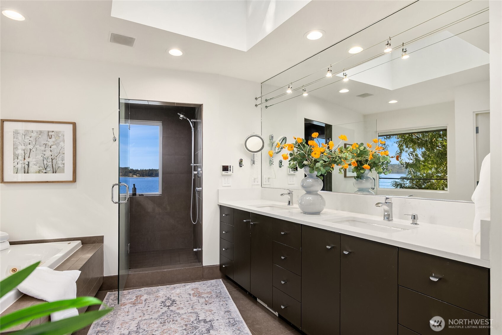 12145 Arrow Point Loop Northeast Bainbridge Island, WA 98110 - Photo 18 of 40 a bathroom with a double vanity sink and a mirror