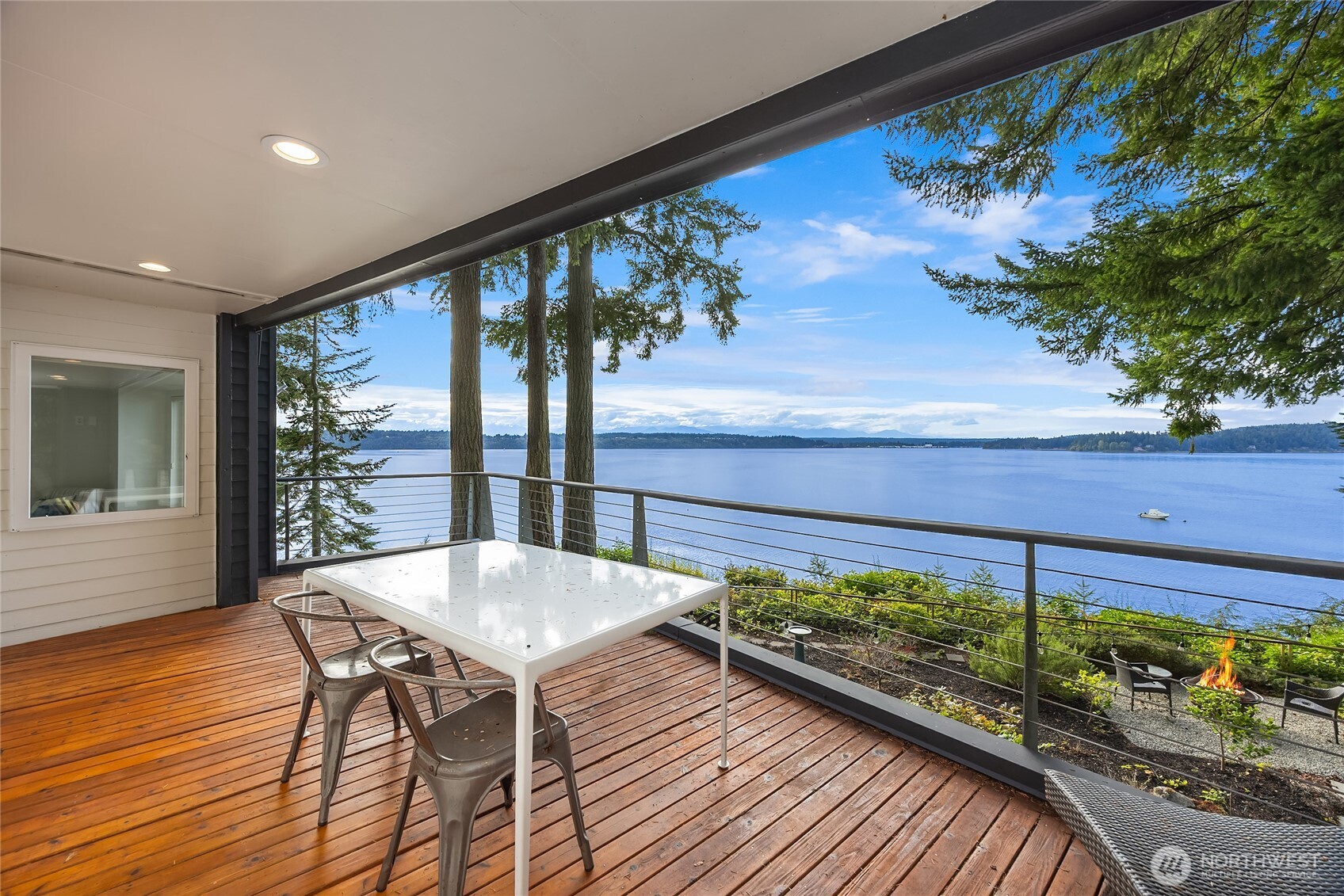 12145 Arrow Point Loop Northeast Bainbridge Island, WA 98110 - Photo 24 of 40 a view of a balcony with chairs