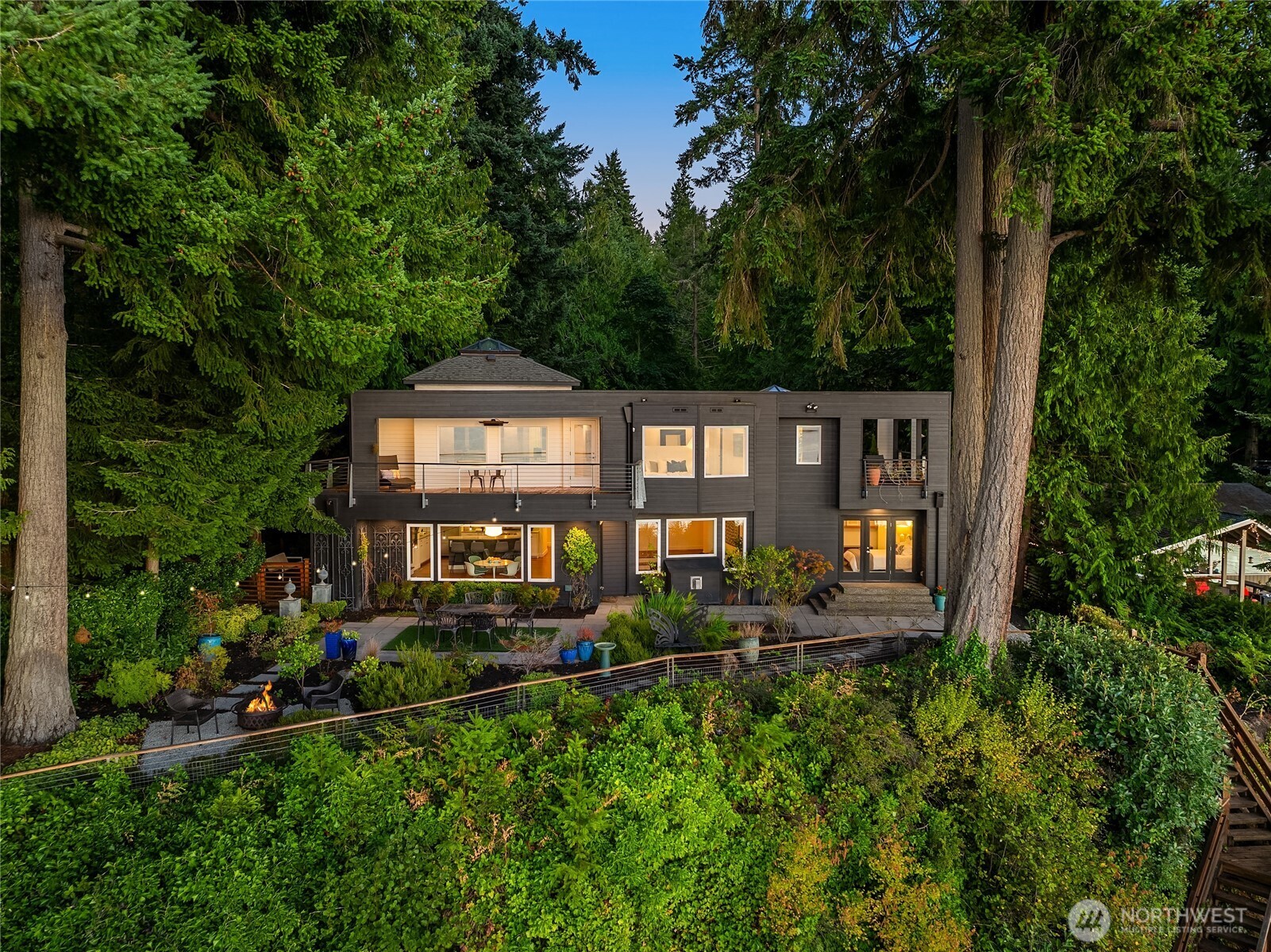 12145 Arrow Point Loop Northeast Bainbridge Island, WA 98110 - Photo 34 of 40 a front view of a house with swimming pool and garden