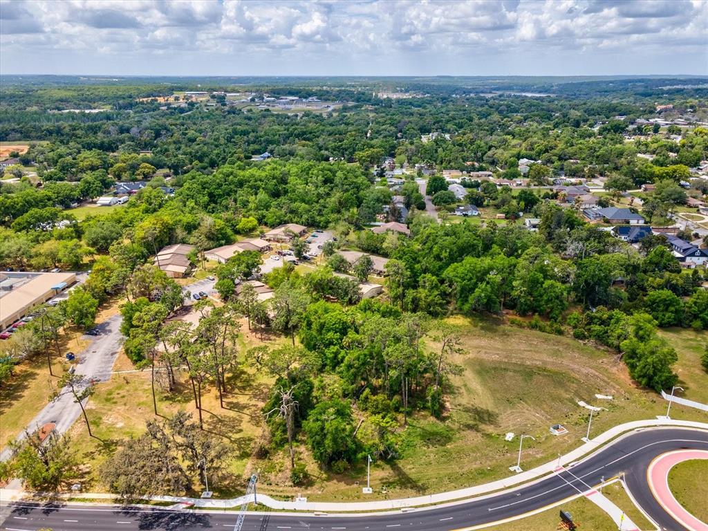 98 State Street Dade City, FL 33525 - Photo 9 of 13 an aerial view of residential houses with outdoor space