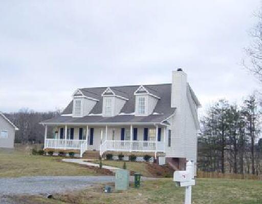 8522 Goodview Road Goodview, VA 24095 - Photo 1 of 1 a front view of a house with garden
