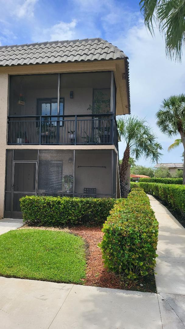 330 Racquet Club Road, Unit 204 Weston, FL 33326 - Photo 1 of 35 a front view of a house with a yard
