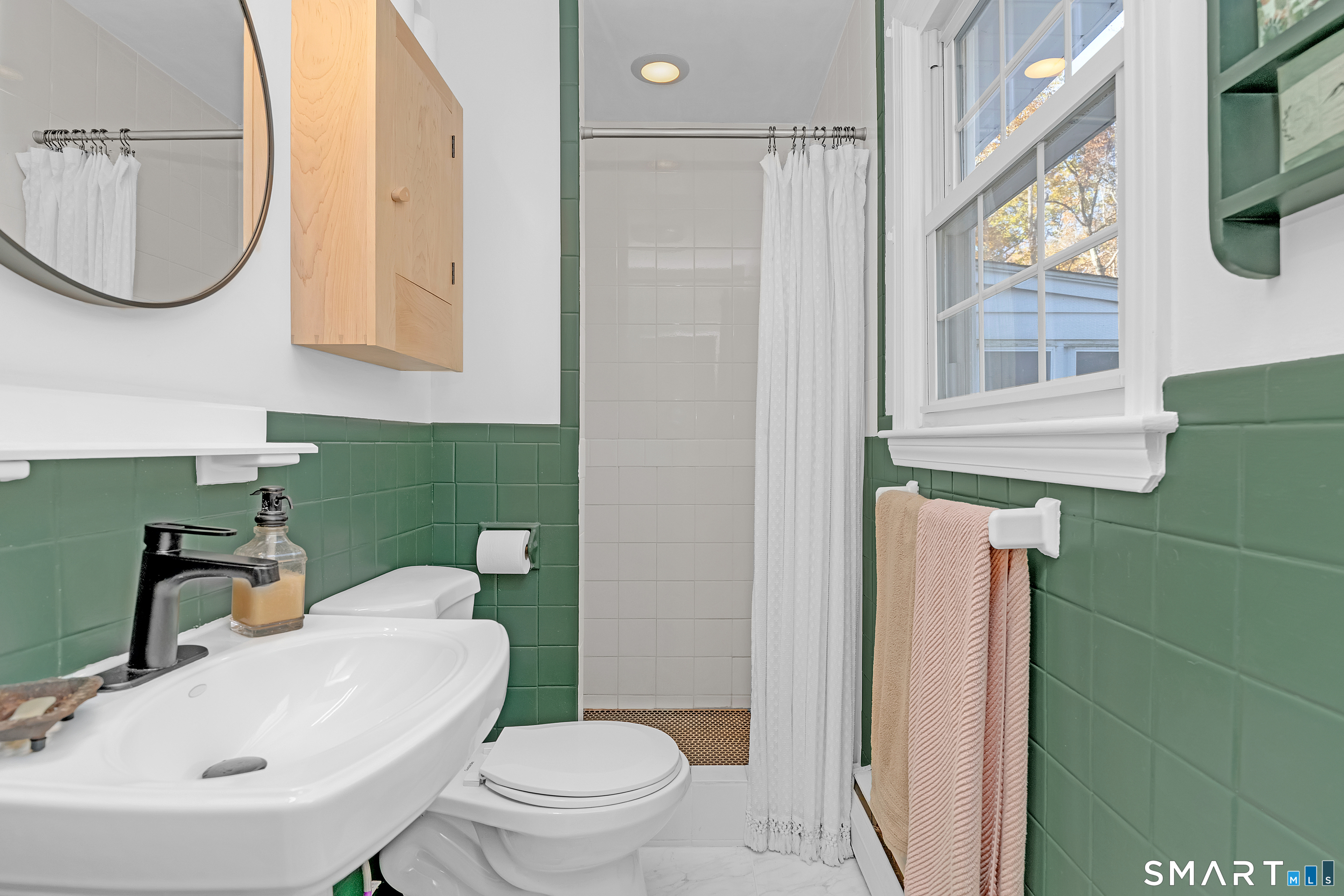 16 Marion Road Bethany, CT 06524 - Photo 20 of 40 a bathroom with a sink a toilet and a mirror