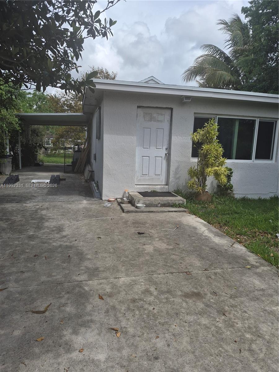 399 Northwest 98th Street Miami, FL 33150 - Photo 6 of 7 a view of a house with a yard