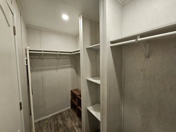 a bathroom with a shower and a mirror
