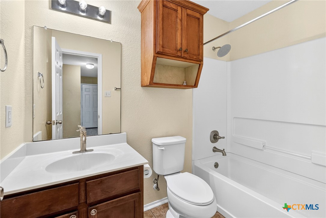 6300 Taree Loop Killeen, TX 76549 - Photo 11 of 13 a bathroom with a sink a toilet and shower