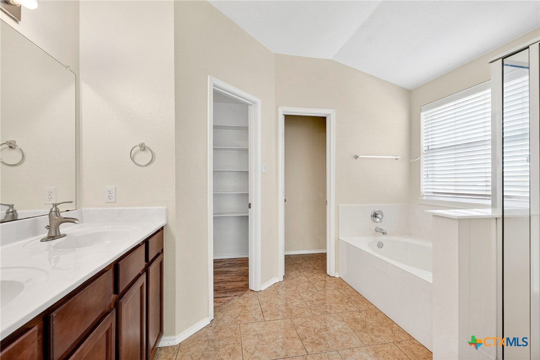 6300 Taree Loop Killeen, TX 76549 - Photo 7 of 13 a spacious bathroom with a tub sink and mirror