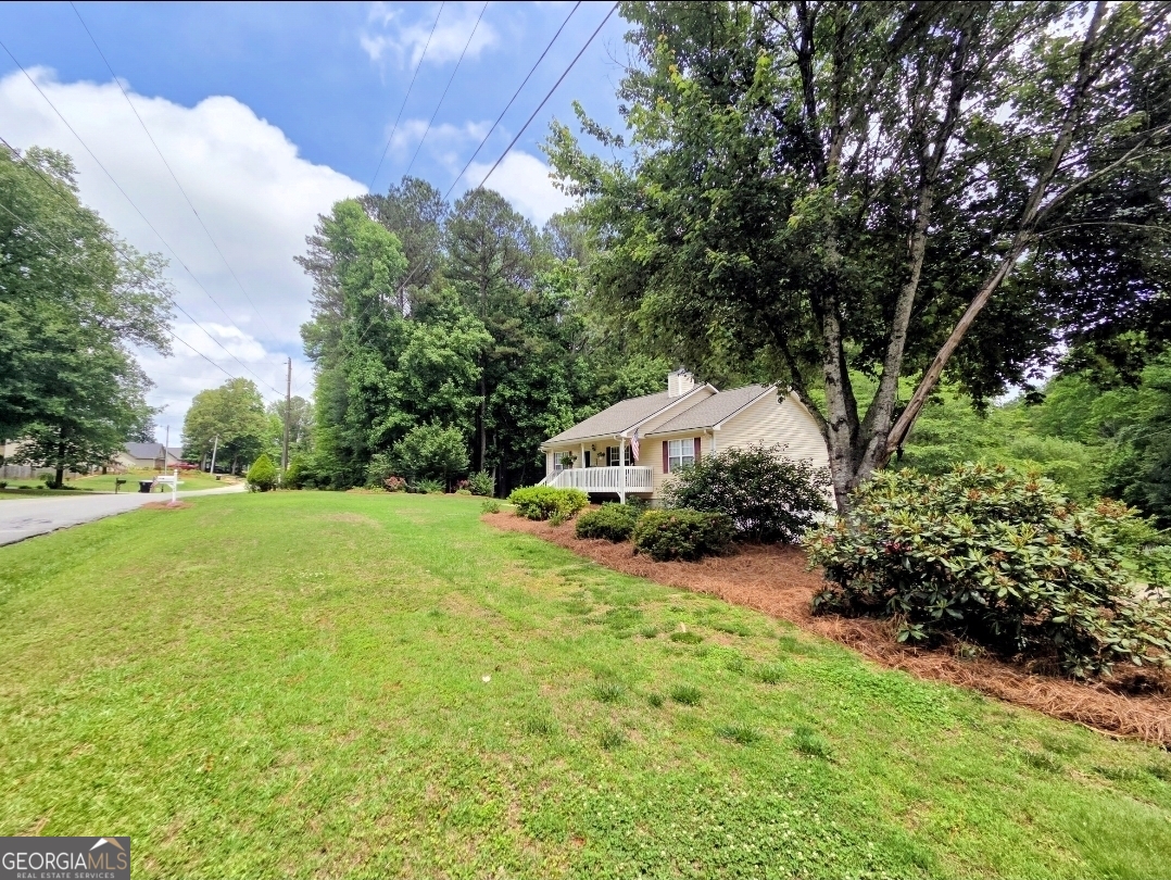21 Baskin Heights Path Temple, GA 30179 - Photo 10 of 44 a view of a garden with a house in the background
