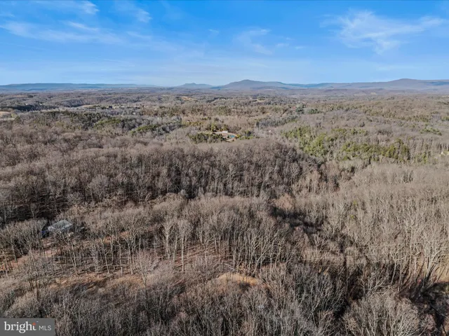 a view of a yard next to a yard