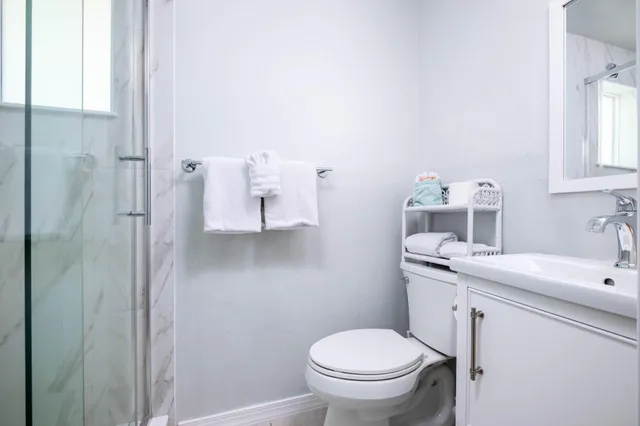 a bathroom with a sink toilet and vanity