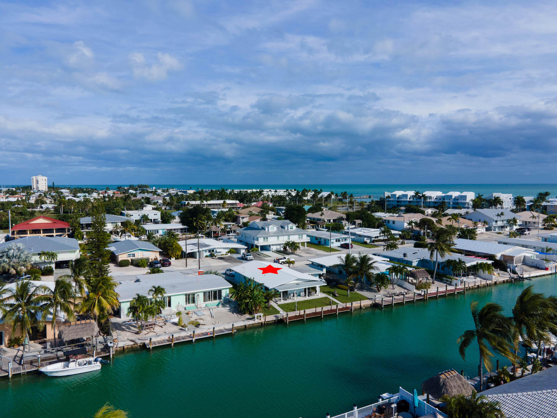 261 9th Street Key Colony Beach, FL 33051 - Photo 3 of 42 an aerial view of a city with lots of residential buildings ocean and mountain view in back