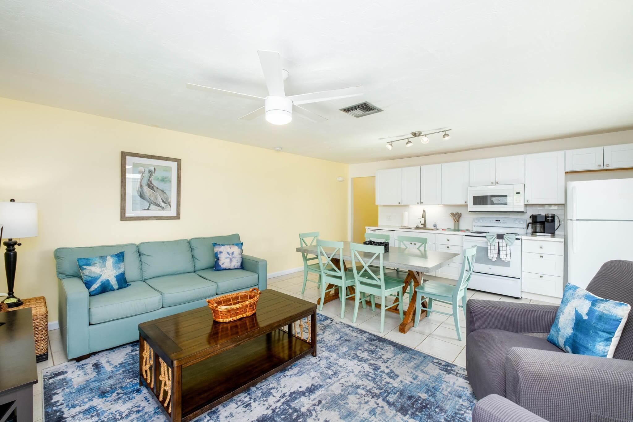 261 9th Street Key Colony Beach, FL 33051 - Photo 9 of 42 a living room with furniture kitchen view and a dining table