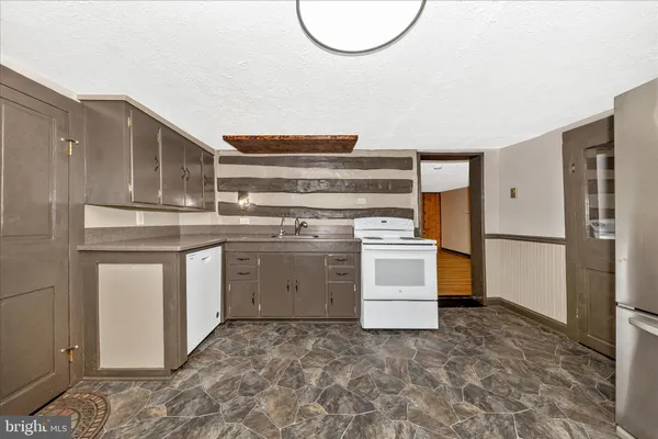 a kitchen with stainless steel appliances cabinets and a sink
