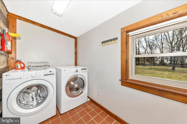 a kitchen with stainless steel appliances granite countertop a stove and a refrigerator