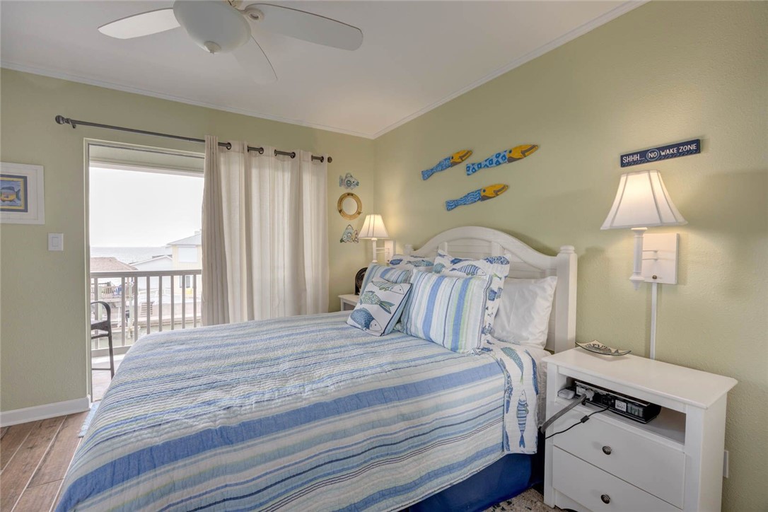 2290 North Fulton Beach Road, Unit 315 Rockport, TX 78382 - Photo 15 of 25 a bedroom with a bed and a window