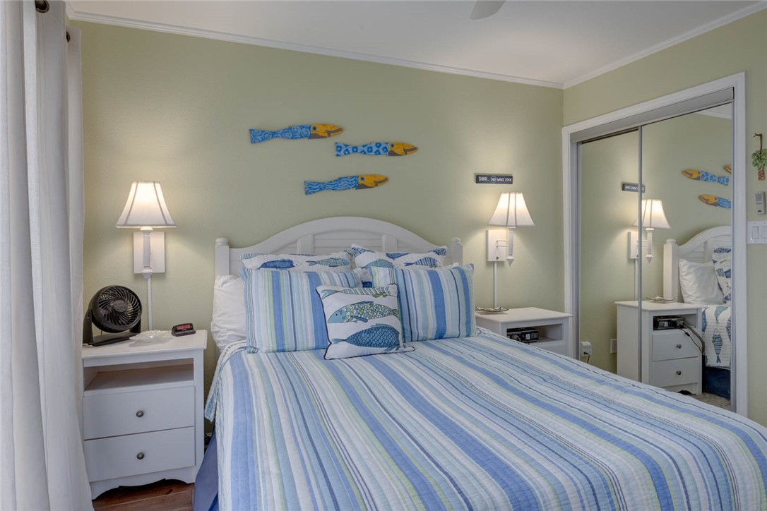 2290 North Fulton Beach Road, Unit 315 Rockport, TX 78382 - Photo 16 of 25 a bedroom with a bed and a closet