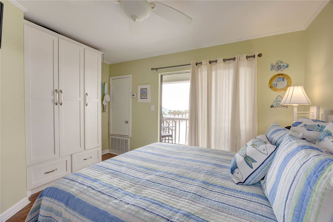 2290 North Fulton Beach Road, Unit 315 Rockport, TX 78382 - Photo 18 of 25 a bedroom with a bed and a window