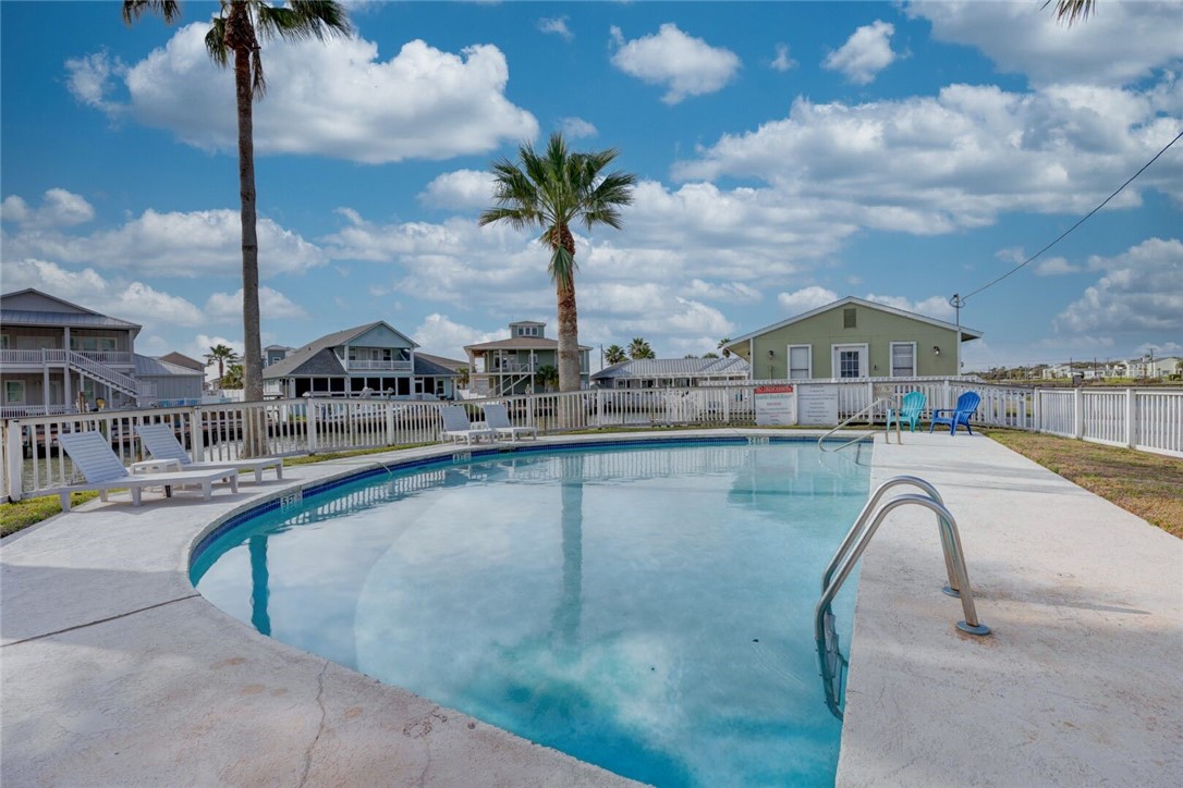 2290 North Fulton Beach Road, Unit 315 Rockport, TX 78382 - Photo 24 of 25 a swimming pool with outdoor seating