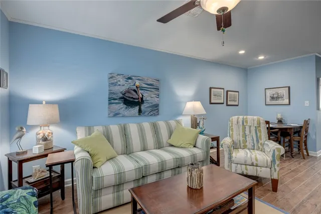a living room with furniture and a lamp