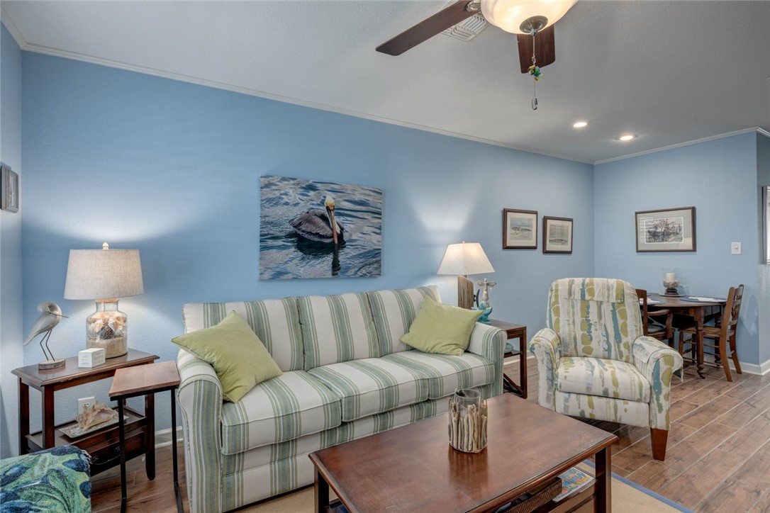 2290 North Fulton Beach Road, Unit 315 Rockport, TX 78382 - Photo 4 of 25 a living room with furniture and a lamp