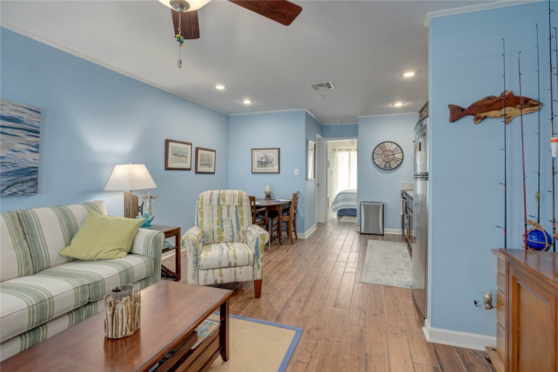 2290 North Fulton Beach Road, Unit 315 Rockport, TX 78382 - Photo 5 of 25 a living room with furniture and wooden floor