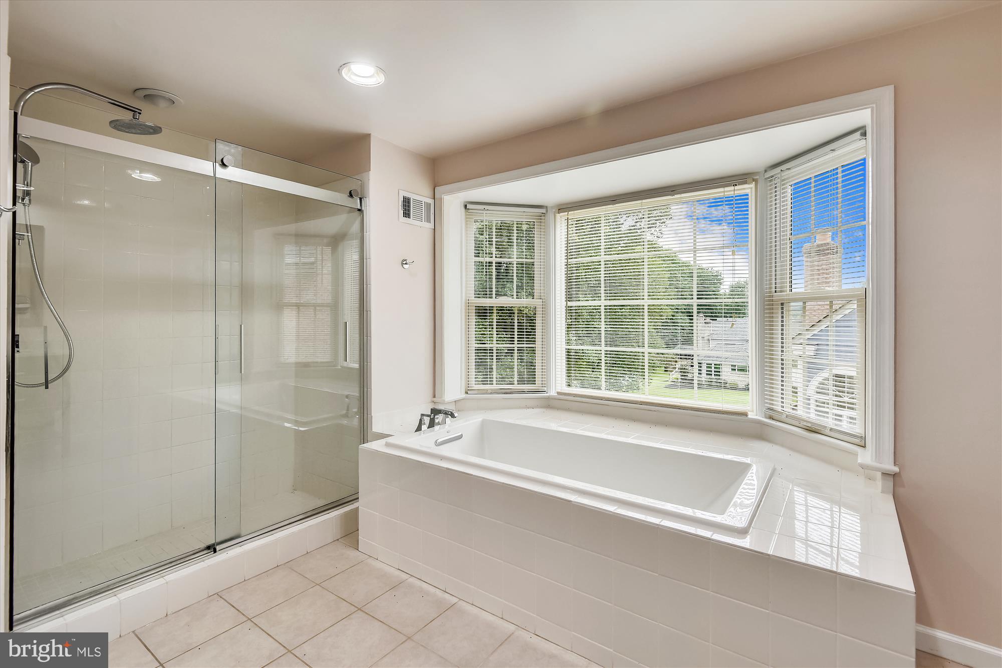 9715 Middleton Ridge Road Vienna, VA 22182 - Photo 15 of 29 a spacious bathroom with a large tub shower and sink