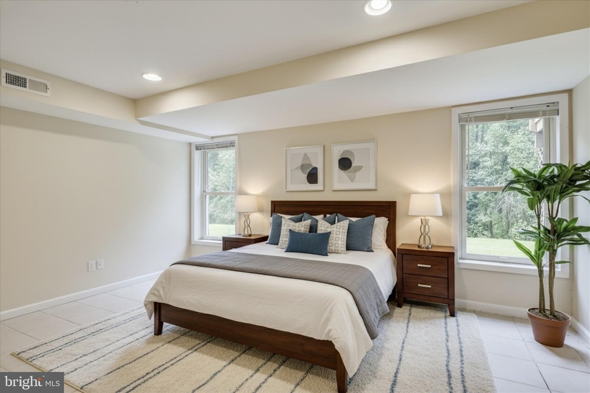 9715 Middleton Ridge Road Vienna, VA 22182 - Photo 17 of 30 a bedroom with a large bed and a potted plant