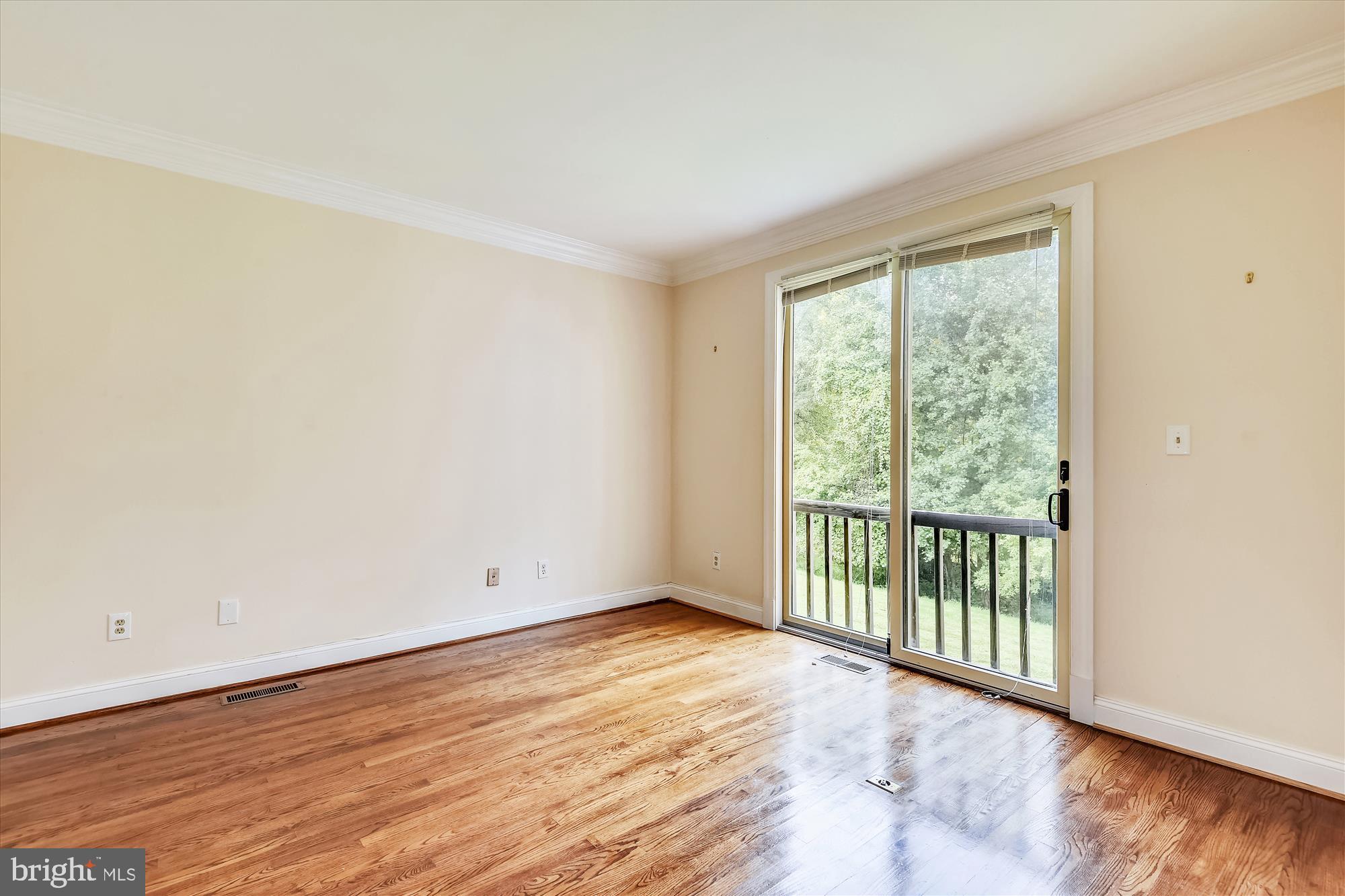 9715 Middleton Ridge Road Vienna, VA 22182 - Photo 18 of 29 a view of a room with wooden floor and window