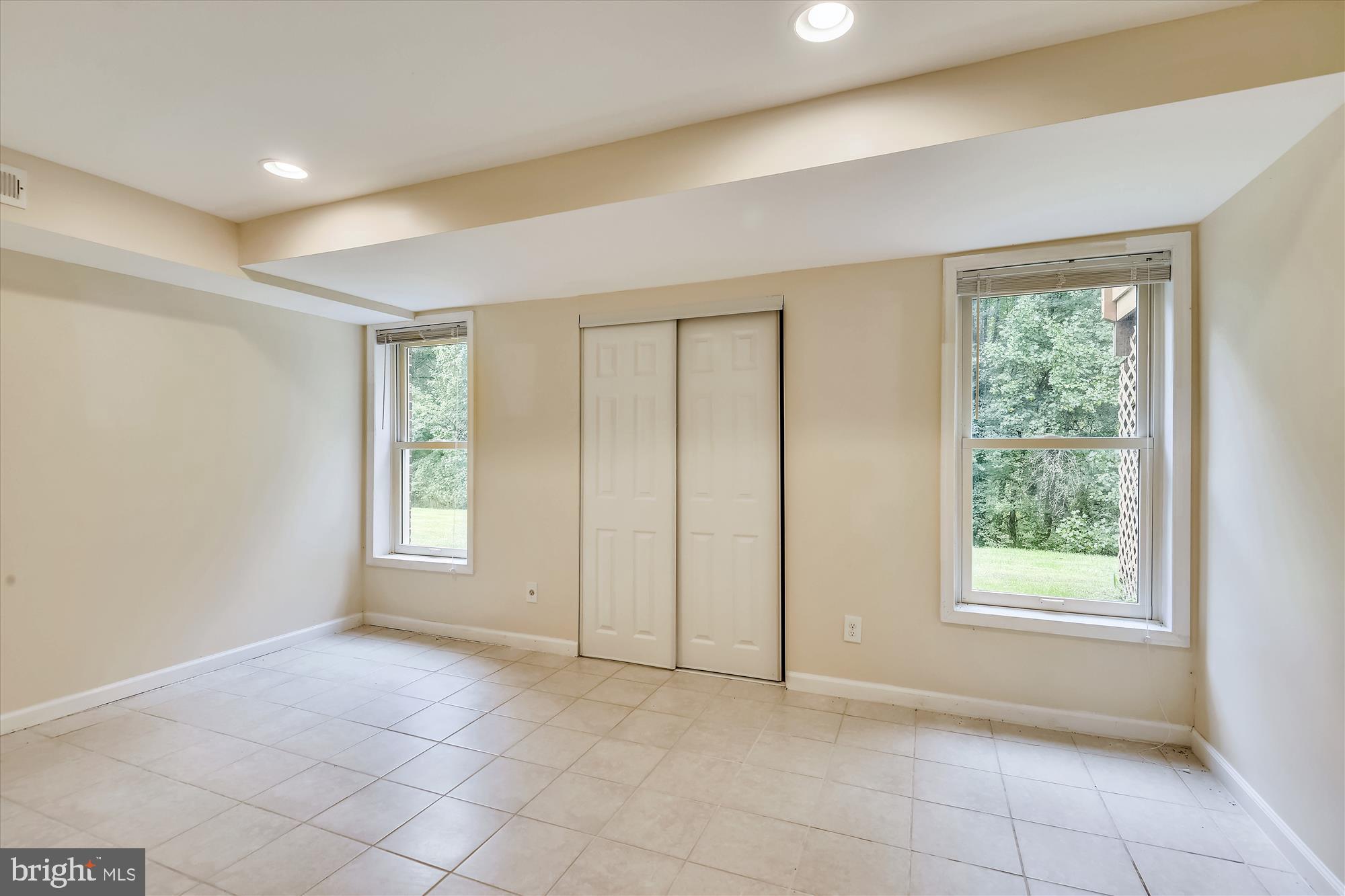 9715 Middleton Ridge Road Vienna, VA 22182 - Photo 20 of 29 a view of an empty room with a window