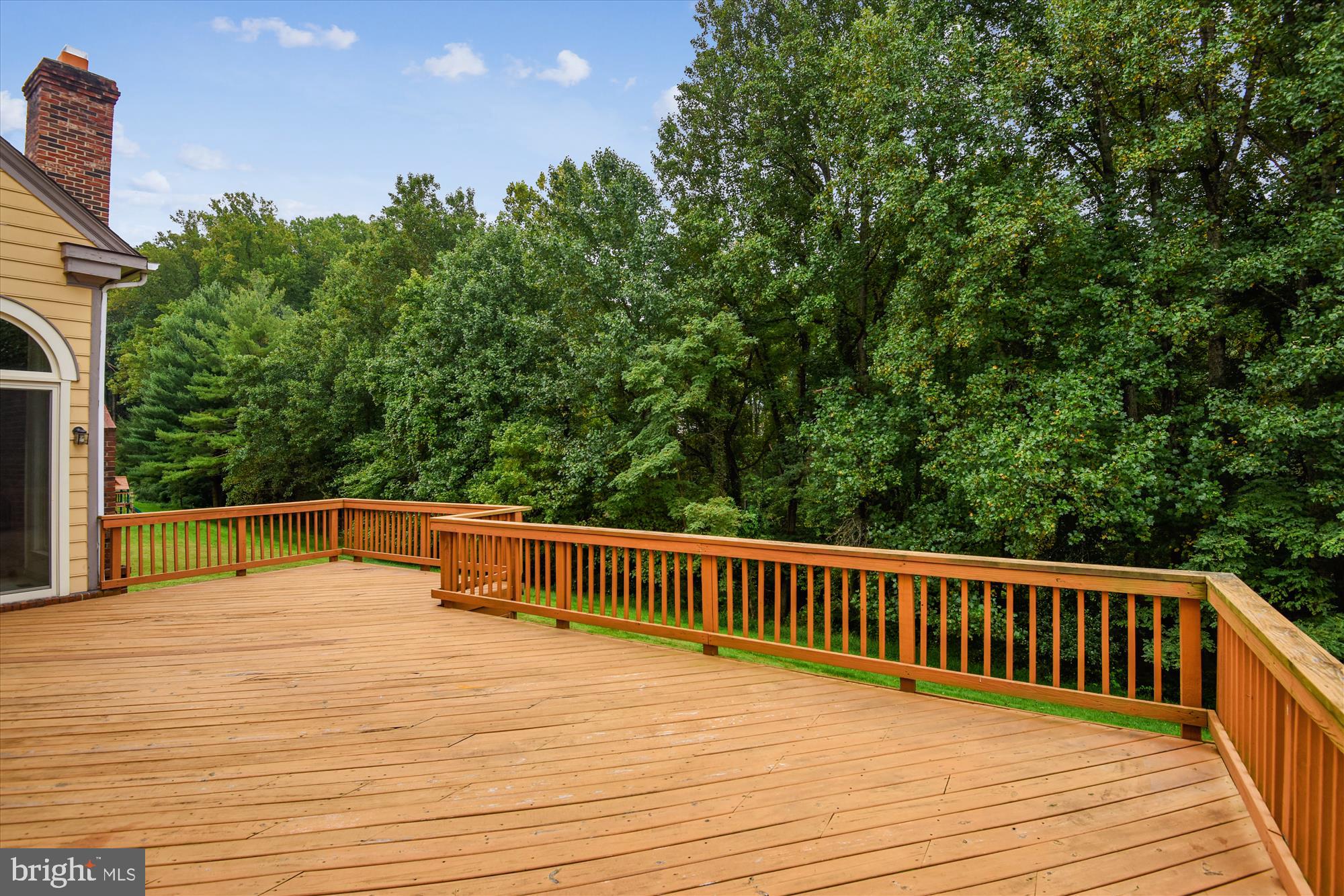 9715 Middleton Ridge Road Vienna, VA 22182 - Photo 27 of 30 a view of a balcony with wooden floor and fence