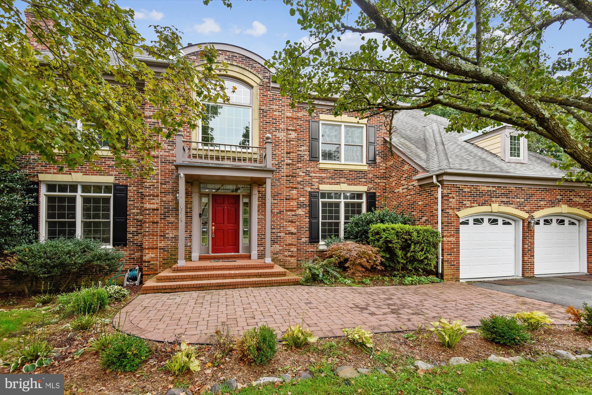 9715 Middleton Ridge Road Vienna, VA 22182 - Photo 3 of 29 front view of a house with a yard
