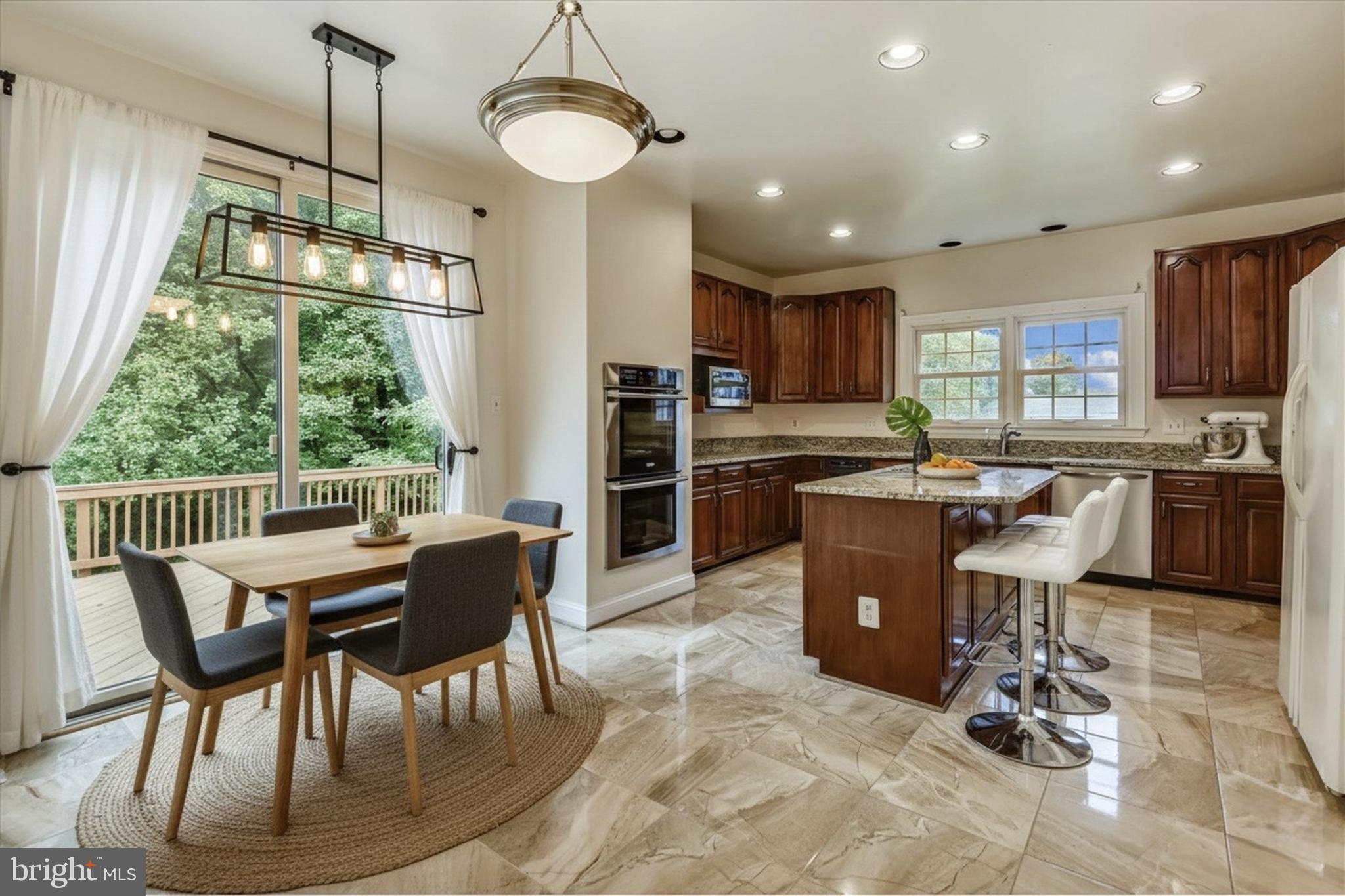 9715 Middleton Ridge Road Vienna, VA 22182 - Photo 8 of 30 a view of a dining room with furniture window and outside view