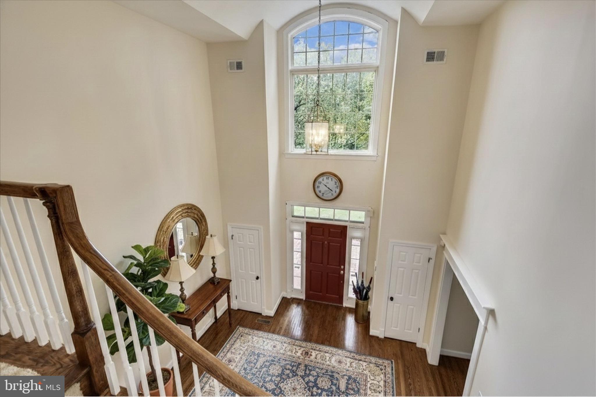 9715 Middleton Ridge Road Vienna, VA 22182 - Photo 9 of 30 an entryway with wooden floor and a window