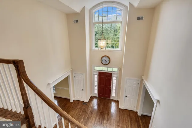 a view of an entryway with wooden floor