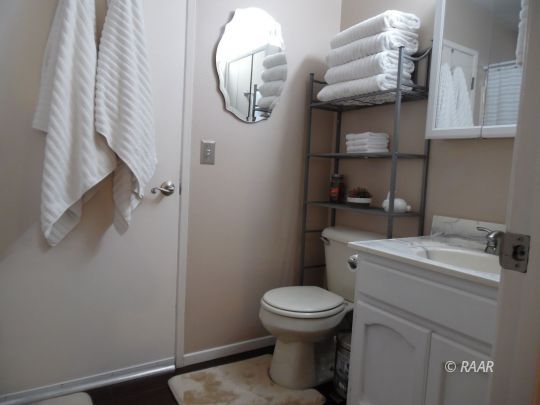 417 Mavis Court Ridgecrest, CA 93555 - Photo 23 of 31 a bathroom with a toilet and a mirror