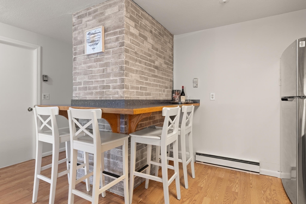 96 Richardson Road, Unit B23 North Chelmsford, MA 01863 - Photo 12 of 31 front view of a room with table and chairs