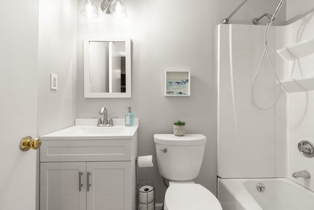 96 Richardson Road, Unit B23 North Chelmsford, MA 01863 - Photo 23 of 31 a bathroom with a sink toilet and shower