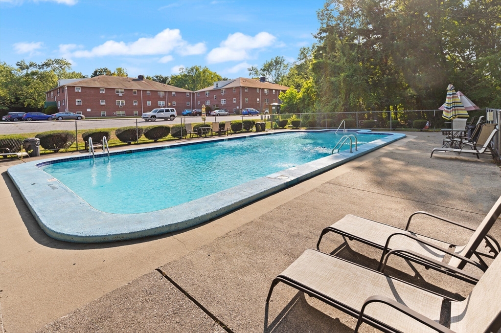 96 Richardson Road, Unit B23 North Chelmsford, MA 01863 - Photo 25 of 31 swimming pool view with a seating space