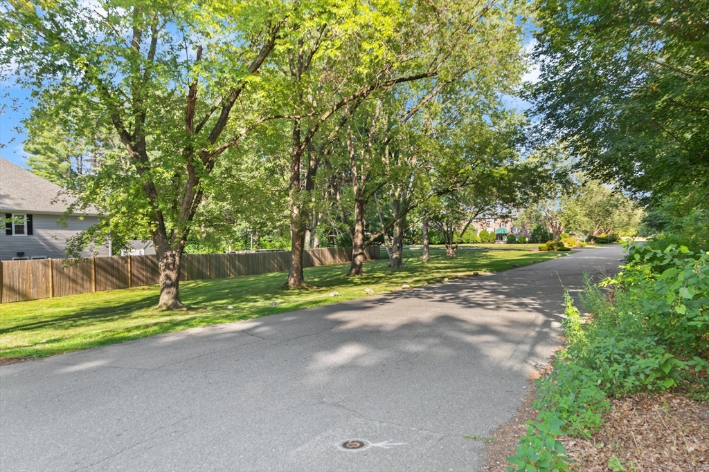 96 Richardson Road, Unit B23 North Chelmsford, MA 01863 - Photo 28 of 31 a view of road with large trees
