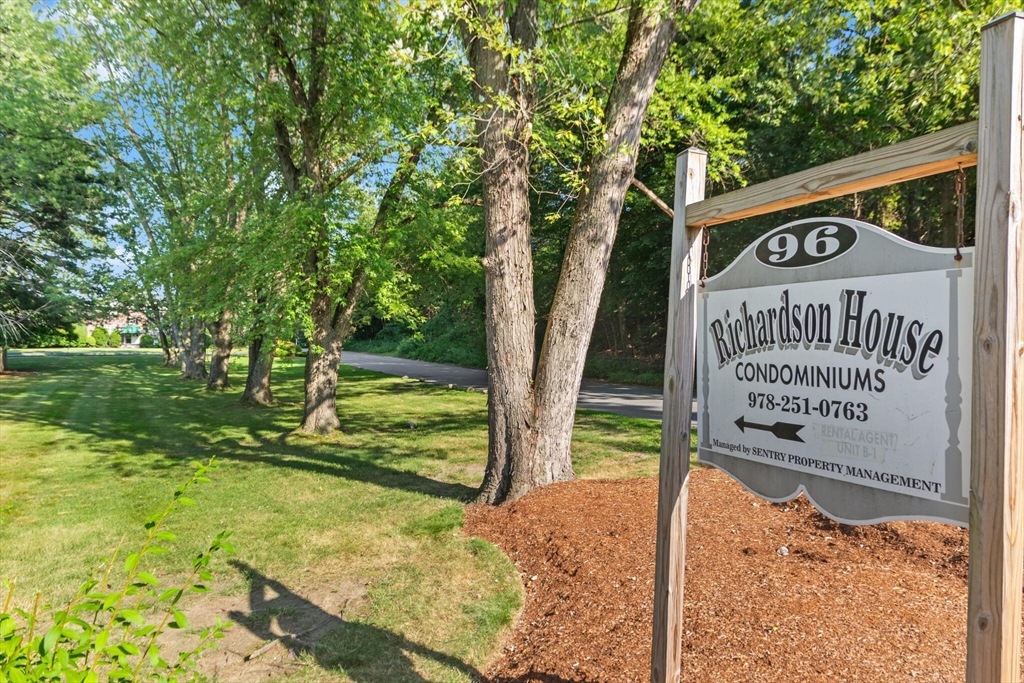 96 Richardson Road, Unit B23 North Chelmsford, MA 01863 - Photo 29 of 31 a sign broad on the side of the road