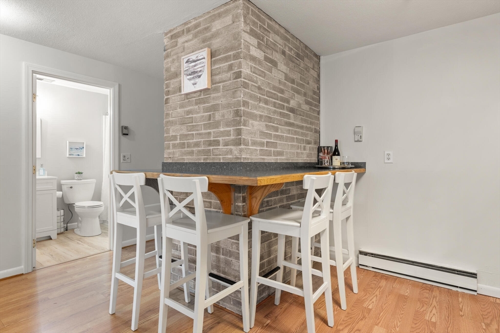96 Richardson Road, Unit B23 North Chelmsford, MA 01863 - Photo 10 of 31 a view of a dining room with chairs
