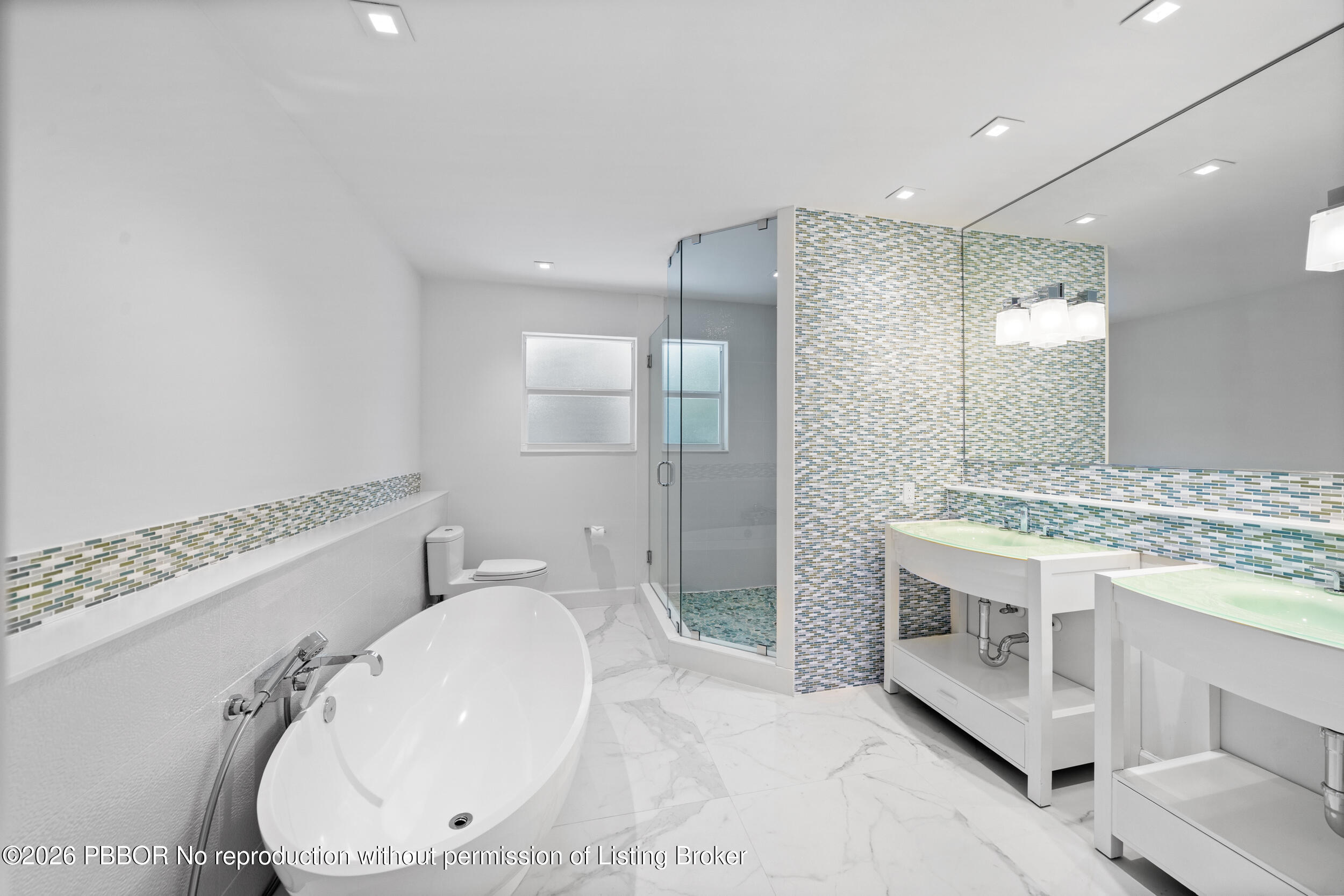 2259 Ibis Isle Road East, Unit E Palm Beach, FL 33480 - Photo 11 of 28 a bathroom with a sink a toilet and shower