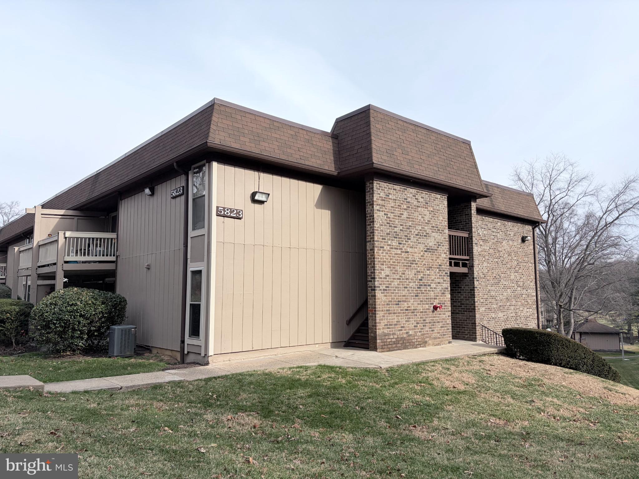 5823 S Royal Ridge Drive Springfield, VA 22152 - Photo 1 of 30 a front view of a house with a yard