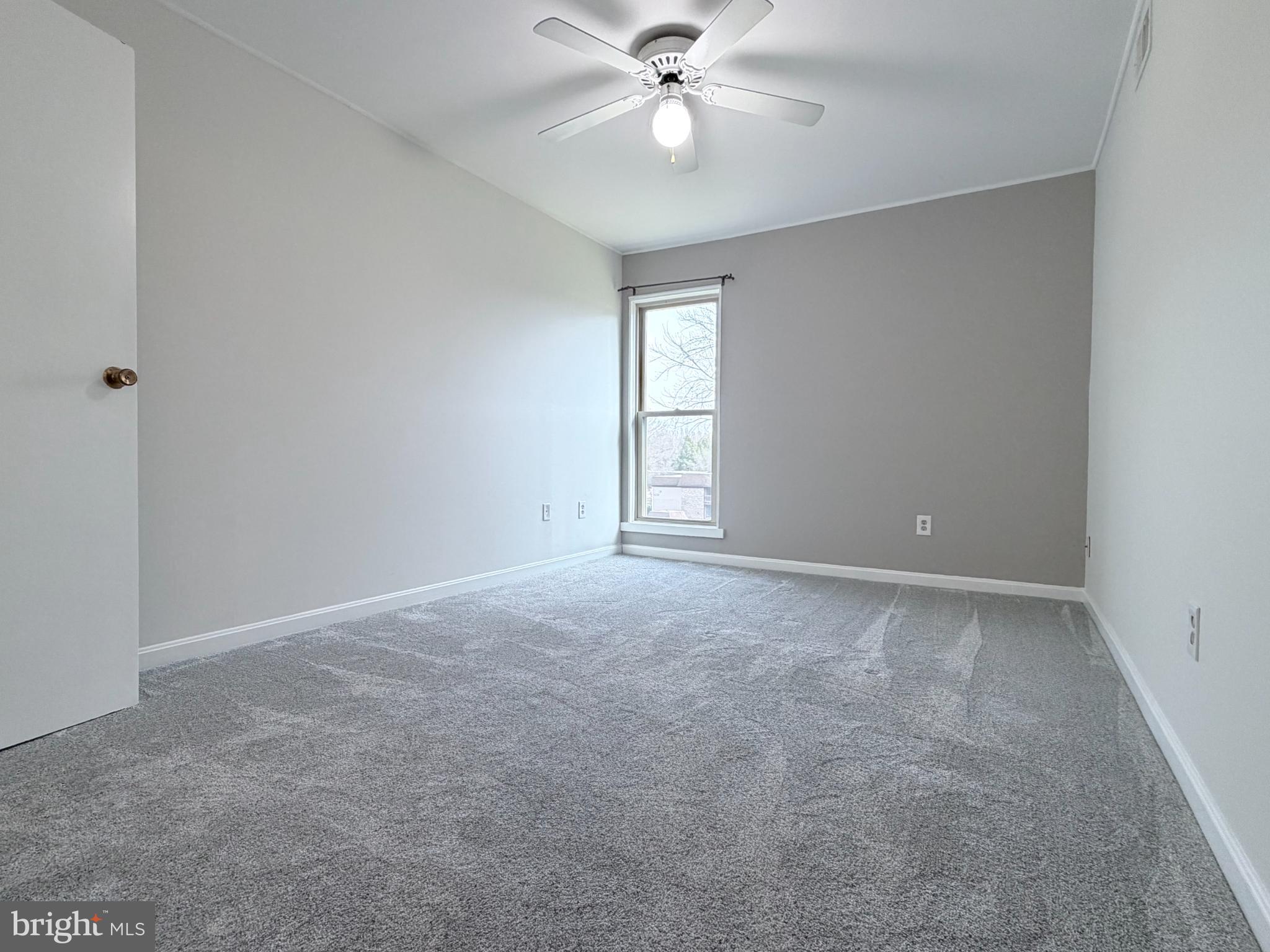 5823 S Royal Ridge Drive Springfield, VA 22152 - Photo 15 of 30 a view of a livingroom with a ceiling fan and window