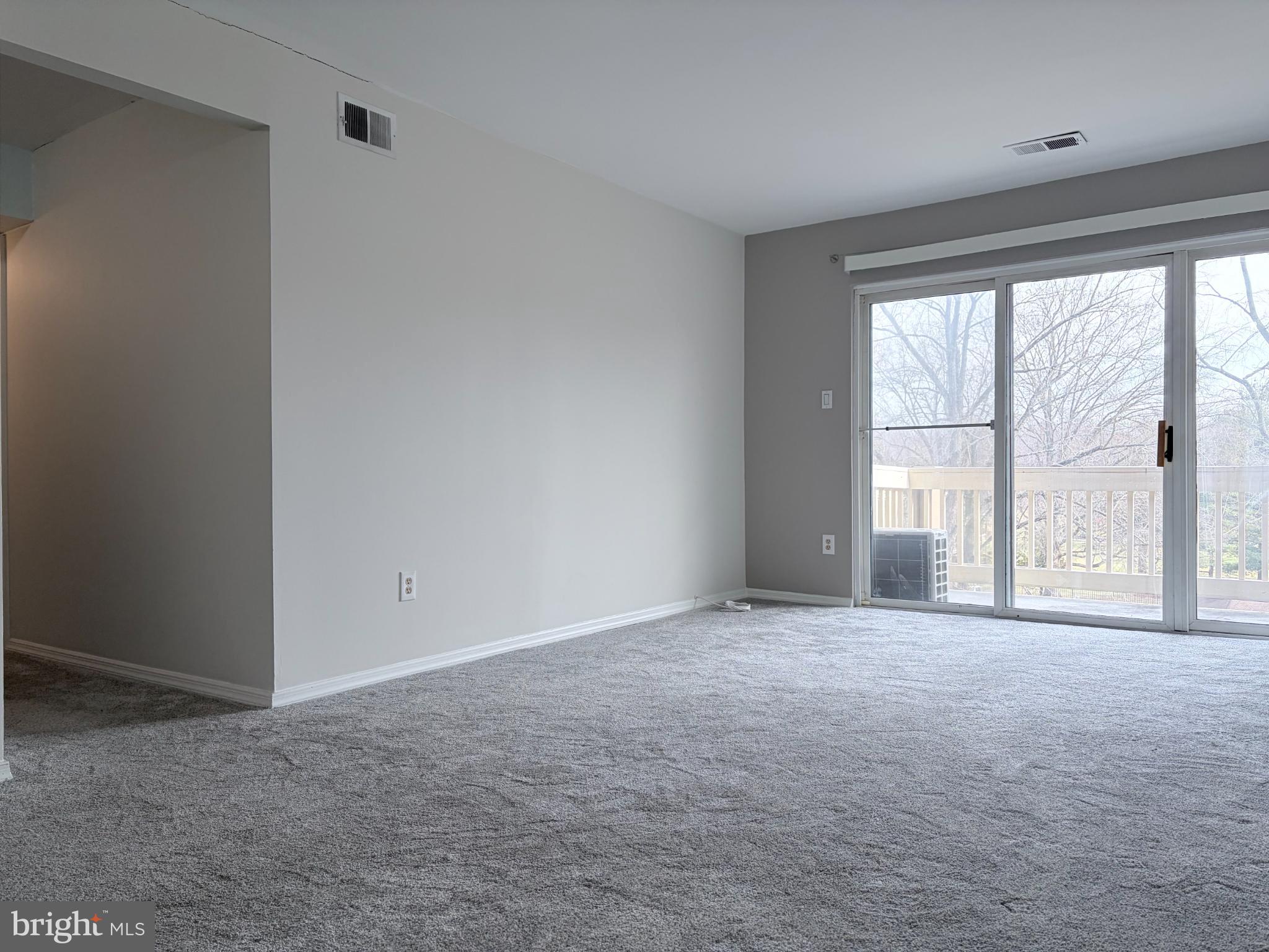 5823 S Royal Ridge Drive Springfield, VA 22152 - Photo 4 of 30 a view of an empty room with a window