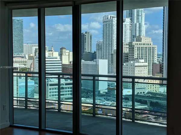 a view of a balcony with two chairs and a table