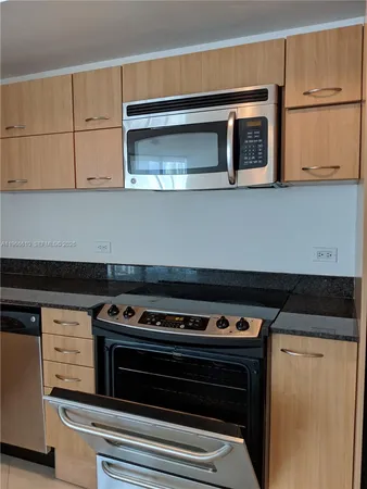 a room with gym equipment and a large window