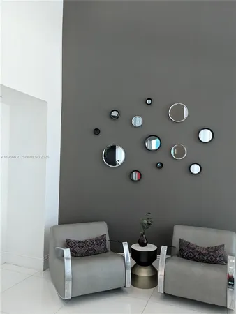 a view of entryway and hall with a chandelier