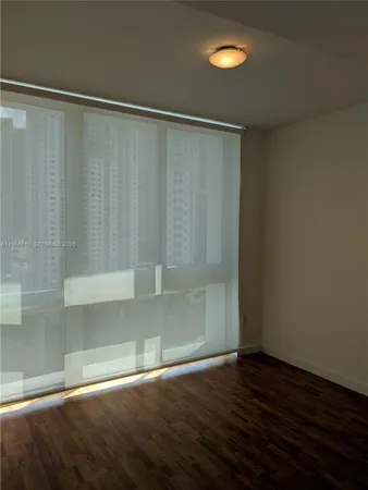 a view of a residential apartment building with a yard