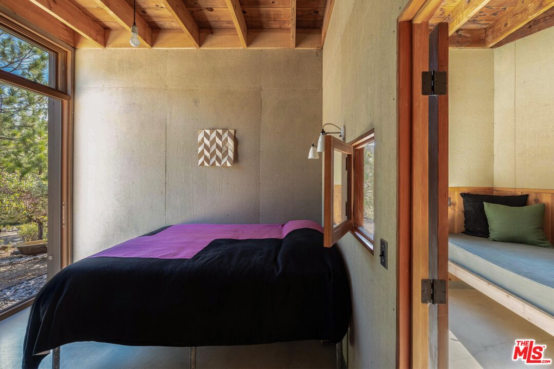 12789 Sailor Flat Road Nevada City, CA 95959 - Photo 14 of 42 a bedroom with a bed and wooden floor